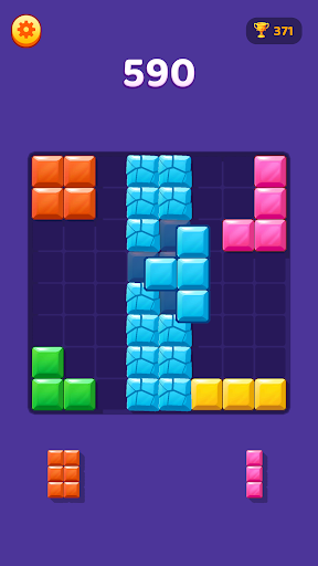 A Block Master board with a tall blue block column and colorful pieces around it.